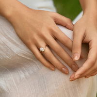 Twisted Elegance: 18K Gold Oval Diamond Ring with Four-Prong Solitaire Design